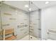 Bathroom featuring tiled shower with a built-in seat at 2 Adalia Ave # 602, Tampa, FL 33606