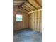 Shed interior showing unfinished walls and exposed framing at 2200 Catalonia S Way, St Petersburg, FL 33712