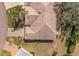 Aerial view of the house with a well manicured yard and mature landscaping at 2218 Mayfield Palms Ln # 323, Sun City Center, FL 33573