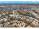 A neighborhood view with mature landscaping and pond views at 2218 Mayfield Palms Ln # 323, Sun City Center, FL 33573
