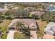 Expansive aerial view of a well-maintained home, complemented by lush green lawns and mature trees at 2218 Mayfield Palms Ln # 323, Sun City Center, FL 33573