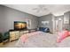 Comfortable bedroom with cozy seating area, dresser, and peaceful decor elements at 2218 Mayfield Palms Ln # 323, Sun City Center, FL 33573