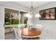 Dining area with sliding doors that lead to the outside at 2218 Mayfield Palms Ln # 323, Sun City Center, FL 33573