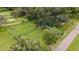 Aerial view of the community dog park with play area, benches and a grassy area at 2218 Mayfield Palms Ln # 323, Sun City Center, FL 33573