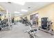 Well-equipped gym with modern exercise machines and large windows at 2218 Mayfield Palms Ln # 323, Sun City Center, FL 33573