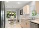 Bright kitchen area with modern appliances and tile flooring at 2218 Mayfield Palms Ln # 323, Sun City Center, FL 33573