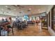 Spacious restaurant area with tables, chairs, televisions and patrons at 2218 Mayfield Palms Ln # 323, Sun City Center, FL 33573