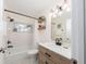 Bright bathroom with modern vanity, updated fixtures, and stylish subway tile in shower at 2405 Indigo Dr, Clearwater, FL 33763