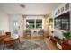 Bright and airy living room featuring stylish seating, a vibrant rug, and plenty of natural light at 2405 Indigo Dr, Clearwater, FL 33763
