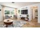 Inviting living room with modern decor, a large window, and a comfortable seating arrangement at 2405 Indigo Dr, Clearwater, FL 33763