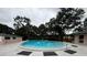 Community swimming pool with a modern design and well-maintained concrete pool deck at 2405 Indigo Dr, Clearwater, FL 33763