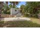 Charming backyard featuring gravel fire pit, Adirondack chairs, and private outdoor space at 2835 Valencia S Way, St Petersburg, FL 33705