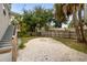 Backyard featuring a pea gravel area with a fire pit and a wooden fence at 2835 Valencia S Way, St Petersburg, FL 33705