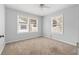 Bright, carpeted bedroom featuring multiple windows, enhancing the natural light and airy feel of the room at 2835 Valencia S Way, St Petersburg, FL 33705