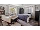 Comfortable bedroom with a cozy seating area, a large bed, and stylish decor creating a relaxing space at 2835 Valencia S Way, St Petersburg, FL 33705