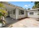 Side of the house with a covered patio and a large window offering ample natural light at 2835 Valencia S Way, St Petersburg, FL 33705