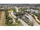 Beautiful aerial view of community entrance featuring water feature and lush landscaping at 30393 Palmer Oak Dr, Wesley Chapel, FL 33543