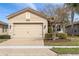 Charming single-Gathering home with a two-car garage and stone accents on the exterior at 30393 Palmer Oak Dr, Wesley Chapel, FL 33543