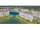 Aerial view of the property featuring resort-style amenities, lush landscaping, and a beautiful waterfront view at 4775 Cove Cir # 205, St Petersburg, FL 33708