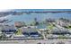 Overhead shot of a waterfront condominium complex with a pond, pool, and access to the bay and ocean at 4775 Cove Cir # 205, St Petersburg, FL 33708