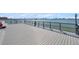 Dock with a metal safety rail offers a secure and scenic spot to enjoy the waterfront at 4775 Cove Cir # 205, St Petersburg, FL 33708
