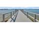 Long, straight dock stretches into the water, providing a peaceful waterfront experience at 4775 Cove Cir # 205, St Petersburg, FL 33708