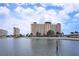 Scenic waterfront condo building boasting beautiful architecture, lovely landscaping, and ample parking at 4775 Cove Cir # 205, St Petersburg, FL 33708