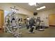 Fitness center featuring various exercise machines and a mirrored wall at 4775 Cove Cir # 205, St Petersburg, FL 33708