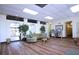 The community lobby features wood floors, seating, plants and a bulletin board at 4775 Cove Cir # 205, St Petersburg, FL 33708