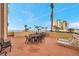 Wide angle shot of a comfortable patio area with tables and chairs, great for relaxation and socializing at 4775 Cove Cir # 205, St Petersburg, FL 33708