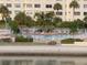 Community pool area offering a tranquil escape with waterfront views and comfortable lounging at 4775 Cove Cir # 205, St Petersburg, FL 33708