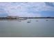 Beautiful wide shot of sail boats, building, and a blue sky with white clouds at 4775 Cove Cir # 205, St Petersburg, FL 33708