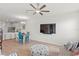 Spacious living room featuring modern furnishings, tile flooring, and seamless transition to the kitchen at 5286 Neil Dr, St Petersburg, FL 33714