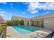 Community pool with lounge chairs and a building with pool rules posted at 5286 Neil Dr, St Petersburg, FL 33714