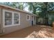 Inviting back deck with beautiful wood finish, ideal for outdoor enjoyment and entertaining at 5502 N 9Th St, Tampa, FL 33604