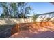 A sunny backyard featuring a wood deck and a newly installed railing at 5502 N 9Th St, Tampa, FL 33604