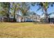 Single story home with a nice front yard and a charming front porch at 5502 N 9Th St, Tampa, FL 33604