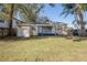 Single story home with a nice front yard and a charming front porch at 5502 N 9Th St, Tampa, FL 33604
