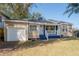 Charming one-story home featuring a front porch and a single car attached garage at 5502 N 9Th St, Tampa, FL 33604