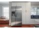 Kitchen featuring stainless steel refrigerator, white cabinets and a cozy bench seating area at 5502 N 9Th St, Tampa, FL 33604