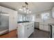 Contemporary kitchen with stainless steel appliances, island, and breakfast nook at 5502 N 9Th St, Tampa, FL 33604