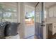 A kitchen with white cabinets leads out to a deck with a new railing at 5502 N 9Th St, Tampa, FL 33604