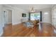 Bright and spacious living room featuring hardwood floors and large windows at 5502 N 9Th St, Tampa, FL 33604