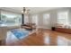 Living room features hardwood floors and large windows at 5502 N 9Th St, Tampa, FL 33604