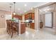Well-equipped kitchen with granite countertops, stainless steel appliances, and a breakfast bar with seating at 6214 45Th E Ln, Bradenton, FL 34203