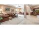 Comfortable living room with neutral tones, stylish furnishings, and an open layout to dining area at 6214 45Th E Ln, Bradenton, FL 34203
