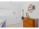 bedroom featuring a lofted bed with play area and a hardwood dresser with a lamp at 6219 Voyagers Pl, Apollo Beach, FL 33572