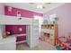 bedroom featuring a lofted bed with desk below and pink shelving at 6219 Voyagers Pl, Apollo Beach, FL 33572
