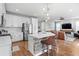 Spacious kitchen with stainless steel appliances, a center island with seating, and an open layout at 6219 Voyagers Pl, Apollo Beach, FL 33572