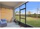 Relaxing screened porch with outdoor seating and a view of the backyard at 6219 Voyagers Pl, Apollo Beach, FL 33572